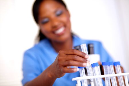 Scientific woman working with test tube at laboratoryの写真素材