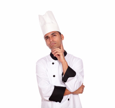 Portrait of a reflective professional chef looking to right up in uniform against white background - copyspaceの写真素材
