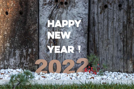 New Years composition 2022 with wooden background logsの写真素材