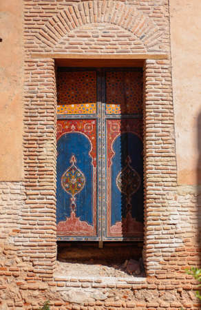 colored door in old arab building in marrakechの写真素材