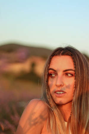 Portrait of woman with lavander shadow at sunsetの写真素材