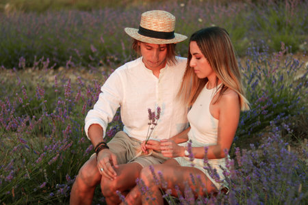 Portrait of young couple in lavander fieldの写真素材