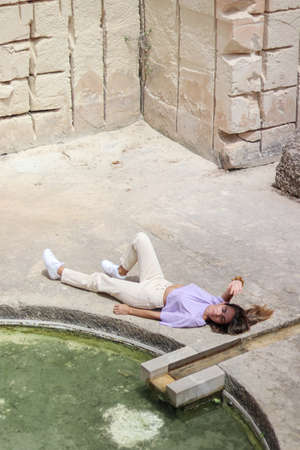 Top fashion portrait of woman in a sandstone quarry of Litica, Menorcaの写真素材