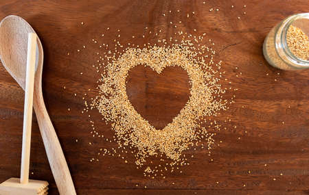 Organic Toasted Sesame Seeds in a Heart Shapeの写真素材