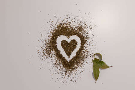 Heart shape made of herbs on a white backgroundの写真素材