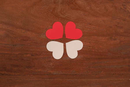 Four heart isolated in a wooden backgroundの写真素材