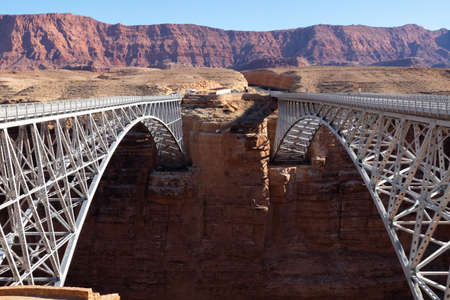 Two bridges at Nvajo bridge with grand canyon in the background. Glen Canyon, Arizona, USAの写真素材