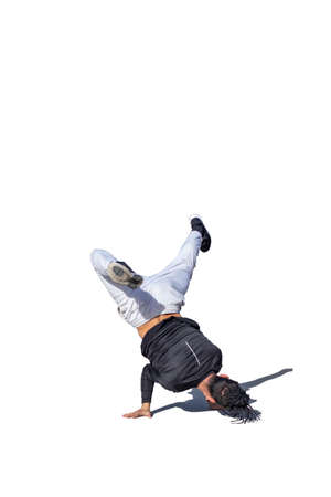Young man doing break dance stunts with shade and white backgroundの写真素材