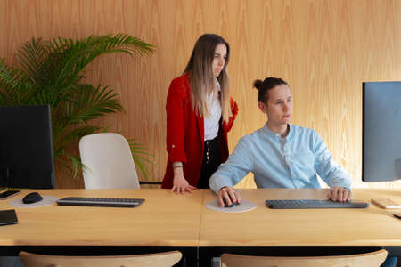 Young man and woman entrepreneurs creating an online business