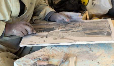 Closeup view of unrecognizable and clopped arab artisan man working in hand made stone engraving in Egyptの写真素材