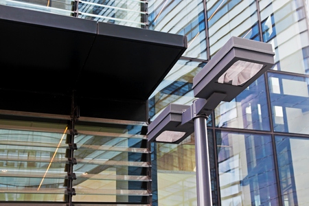 Lantern and modern office building in financial districtの写真素材