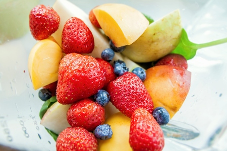 Strawberry blueberry peach apple fruit mix for smoothieの写真素材