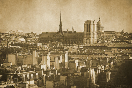 Vintage retro old styled paris sepia photography with notre dame cathedralの写真素材