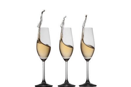 Chanpagne splashing in a synchronized way in glasses.の写真素材