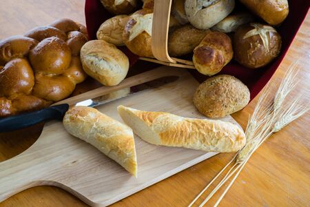 Collection of breads including Challah, baguettes and rolls