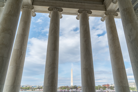 View of the Washington Monument through the columns of the Jefferson Memorial in Washington DCのeditorial素材