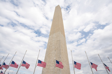 The Washington Monument surrounded by flags in Washington, DCのeditorial素材