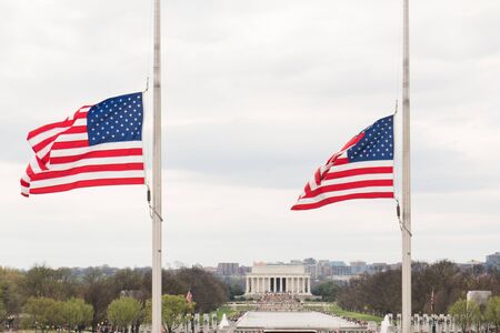 WASHINGTON, DC - MARCH 2016: Lincoln Memorial along the National Mall with United States flags from the Washington Memorial in the foregroundのeditorial素材
