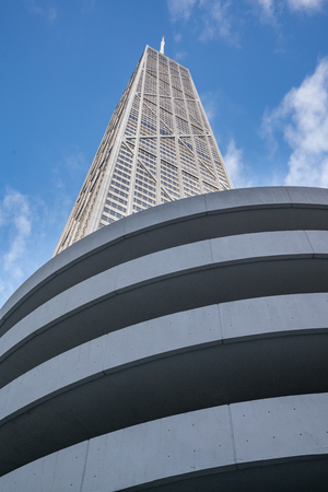 CHICAGO - SEPTEMBER 18: John Hancock Tower in Chicago, Illinois with curved building in foreground.のeditorial素材