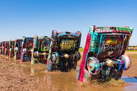 AMARILLO, TX-OCTOBER 12: Old Cadillac cars burried at the famous Cadillac Ranch Ranch along historic Route 66 near Amarillo, TX on October 12, 2017のeditorial素材
