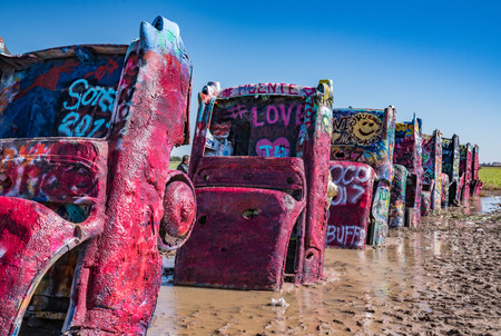 AMARILLO, TX-OCTOBER 12: Old Cadillac cars burried at the famous Cadillac Ranch Ranch along historic Route 66 near Amarillo, TX on October 12, 2017のeditorial素材