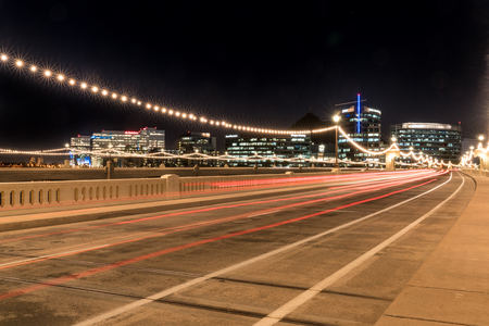 TEMPE, AZ - OCTOBER 25, 2017: The city skyline of Tempe, Arizona at night from the Mill Avenue Bridge across the Salt River at Tempe Town Lakeのeditorial素材