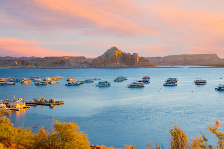 PAGE, AZ - OCTOBER 22, 2017: Houseboats during sunrise near Wahweap Marina on Lake Powell in Page, Arizona.のeditorial素材