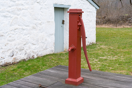 Old Red Manual Water Well Pumpの写真素材
