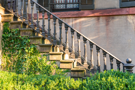Old decorative cast iron stairs in historic home in Savannah, Georgia