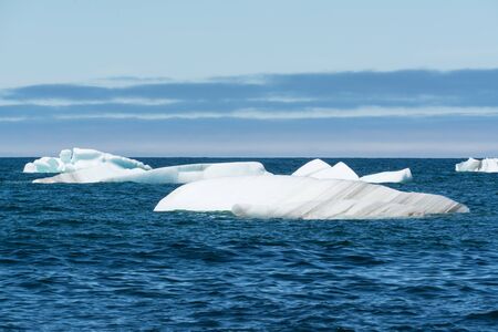 Iceberg floating in the ocean off the coast of Newfoundland, Canada