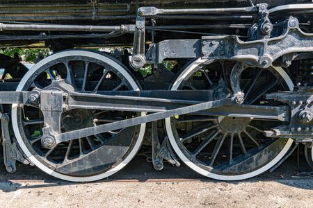 Old iron steam locomotive wheels and machinery