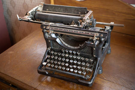 Vintage old antique black typewriter on a desk