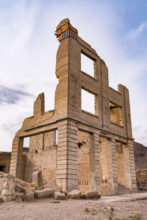 Ghost town ruins of abandoned buildings in the old boom town of Rhyolite, Nevadaの写真素材
