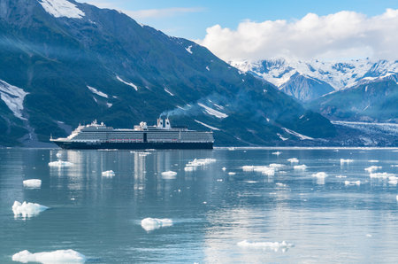 Glacier Bay, AK - September 5, 2022: Holland America cruise ship Nieuw Amsterdam sailing through the icy waters of  Glacier Bay, Alaskaのeditorial素材