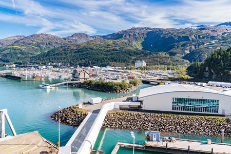 Whittier, AK - September 4, 2022 - Skyline of the port of Whittier, Alaska with the cruise ship terminal in the foreground.のeditorial素材
