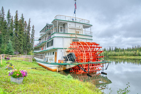 Fairbanks, Alaska - August 27, 2022: Riverboat Discovery III docked at the Chena Village in Fairbanks, Alaska. The stern wheel boat is owned by the Binkley family who run tours along the Chena River.のeditorial素材