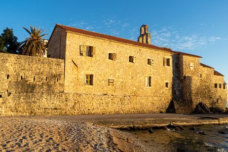 old stone house in the sunset lightの写真素材