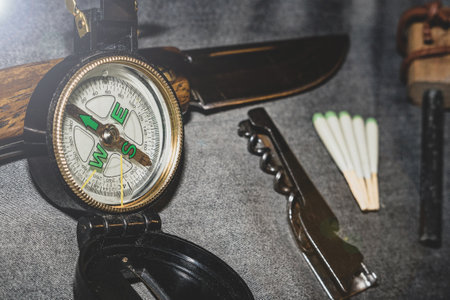 Compass, knife and matches. EDC. Wearable set for survival and tourism.の写真素材
