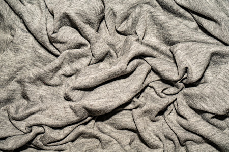 Pleats on the gray cotton fabric. The crumpled gray fabricの写真素材