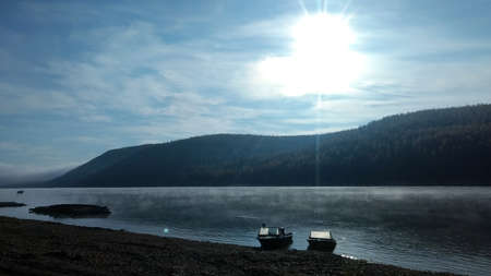 The Lena River. Fishing boats on the bank of the taiga river.の写真素材