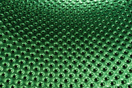 Metal surface with many holes. Perforated metal sheetの写真素材