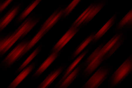 blurred diagonal stripes of red on black background. The effect of movementの写真素材
