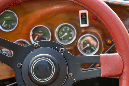 selective focus of steering wheel and dashboard of classic car.の写真素材