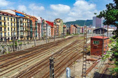 Apartment buildings located near a major railway junction. Railway rails near a residential area, Bilbao, Spain.の写真素材