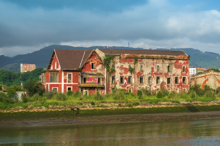 An old abandoned house on the outskirts of Bilbao, on the Nervion Riverの写真素材