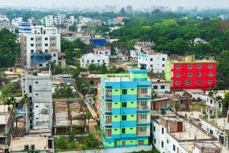 Urban landscape with dense development colorful buildings and lush greenery, showcasing the dense architectural layout of city, Rajshahi, Bangladeshの写真素材