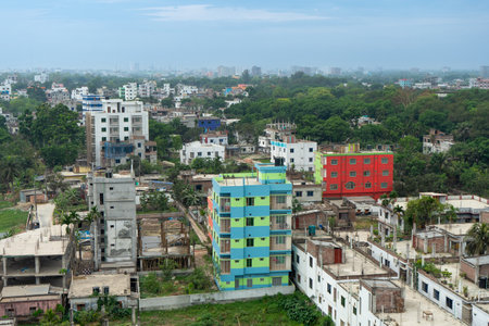 Urban landscape with dense development colorful buildings and lush greenery, showing the dense architectural layout of the city, Rajshahi, Bangladesh.の写真素材