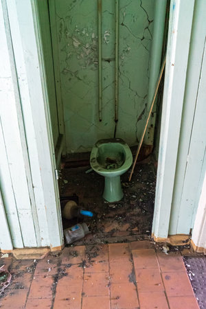 Old dirty toilet in an abandoned houseの写真素材