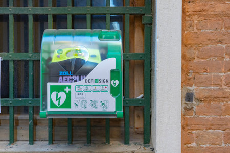 Venice, Italy - 10.11.2024: Public ZOLL AED Plus defibrillator station in Street Venice. Automated...