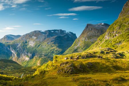 08/09-17, Geiranger, Norway. View from road 63, near Geiranger. Six old cabins are scattered on top of a hill. The area is a part of the Geirangerfjord, which is a UNESCO world heritage site.の写真素材